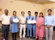Grade 10 students Neeti Jha, Shivashish Nath Roy and Shivam Kumar with their National Junior Ideathon 2026 certificates and teachers at Sulabh Public School, Delhi