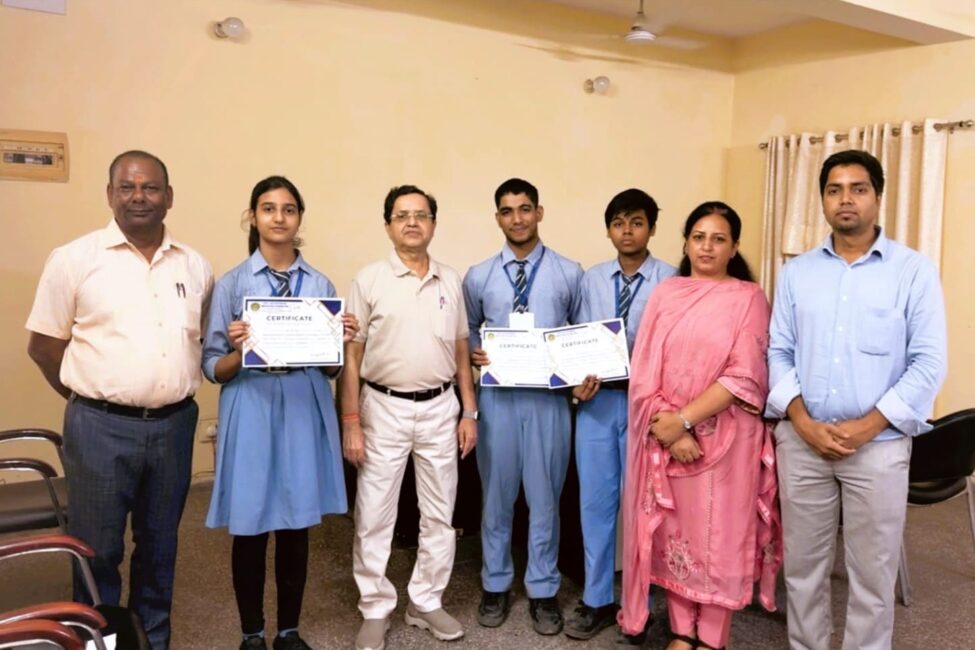 Grade 10 students Neeti Jha, Shivashish Nath Roy and Shivam Kumar with their National Junior Ideathon 2026 certificates and teachers at Sulabh Public School, Delhi