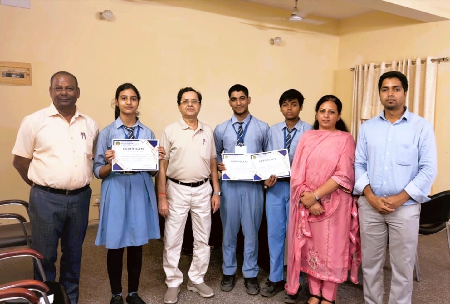 Grade 10 students Neeti Jha, Shivashish Nath Roy and Shivam Kumar with their National Junior Ideathon 2026 certificates and teachers at Sulabh Public School, Delhi