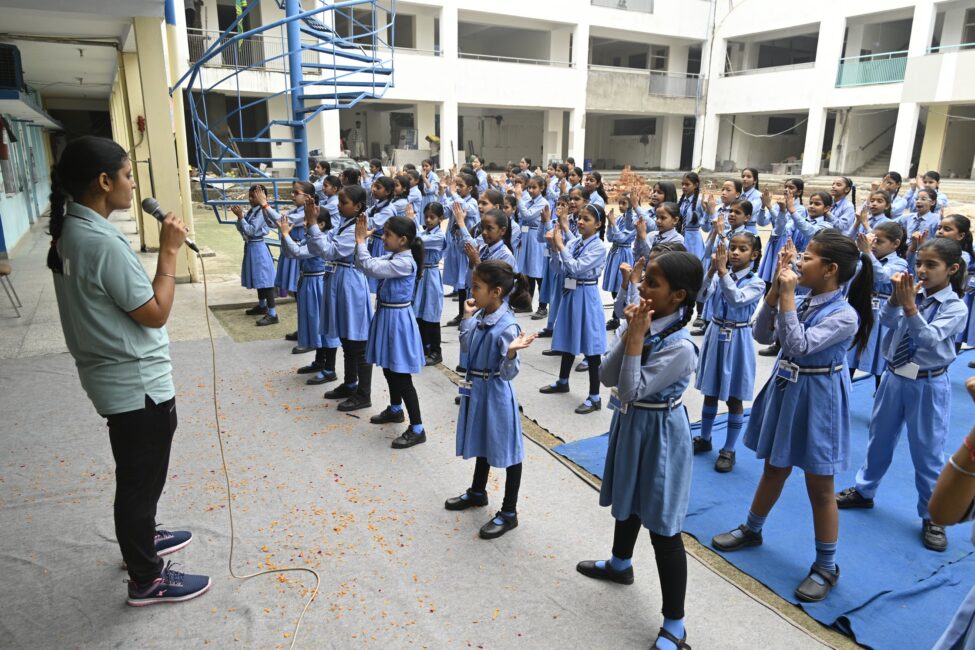 SPUWAC Delhi Police trainer leading a self-defense training session for girl students at Sulabh Public School